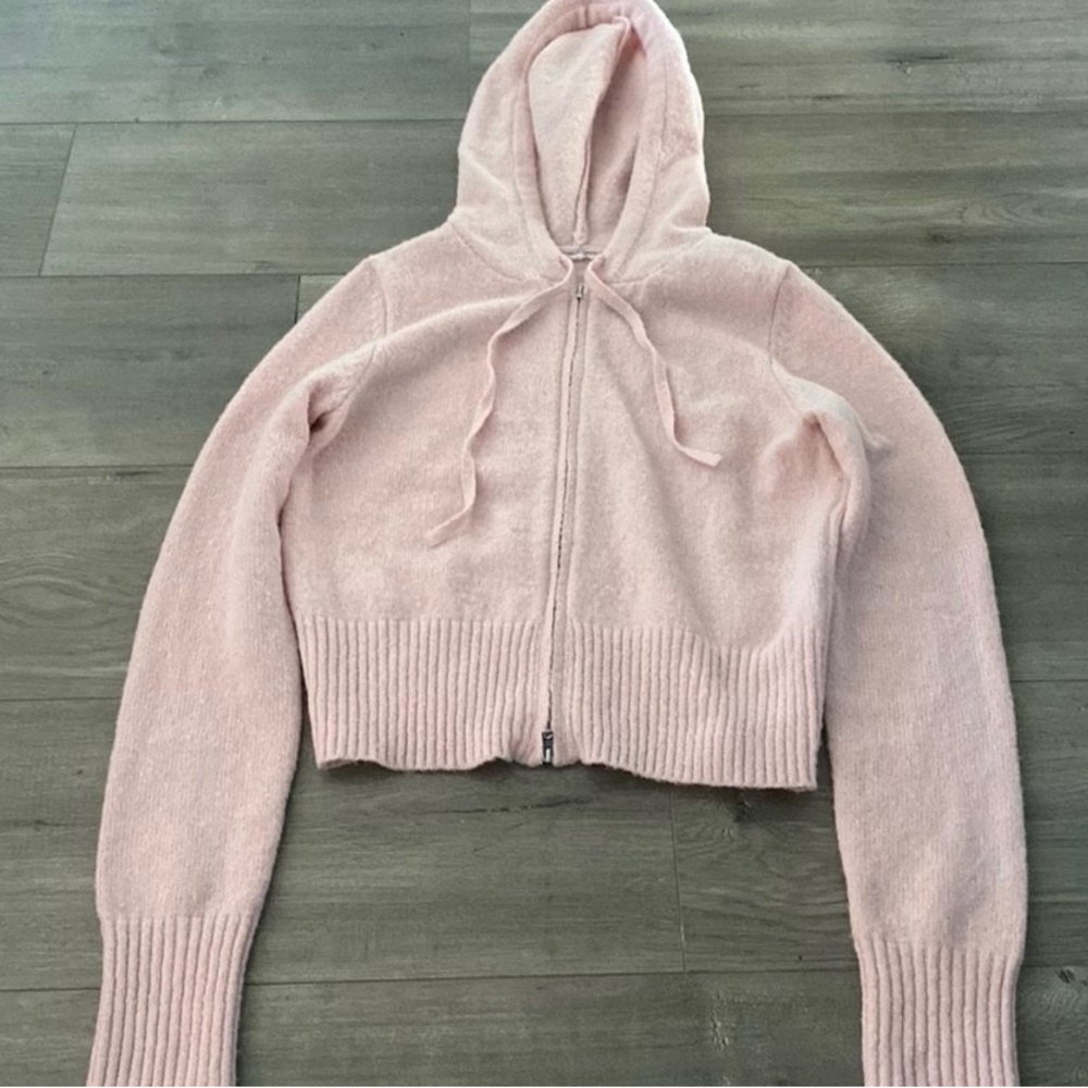 Pink zip up hoodie. Garage brand. Never worn. Size large.